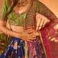 Royal blue pomme panel lehenga with embroidered pear green blouse
