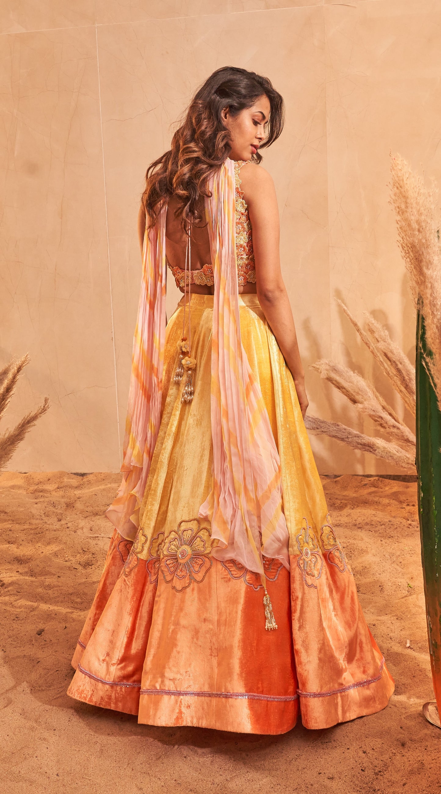 Sunset yellow velvet lehenga with 3D embellished flower blouse