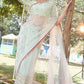 Mint green wildflower underskirt with net saree and raw silk blouse