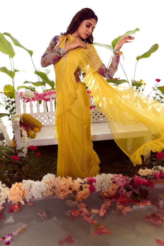 Yellow ruffled saree with wild flower organza statement blouse